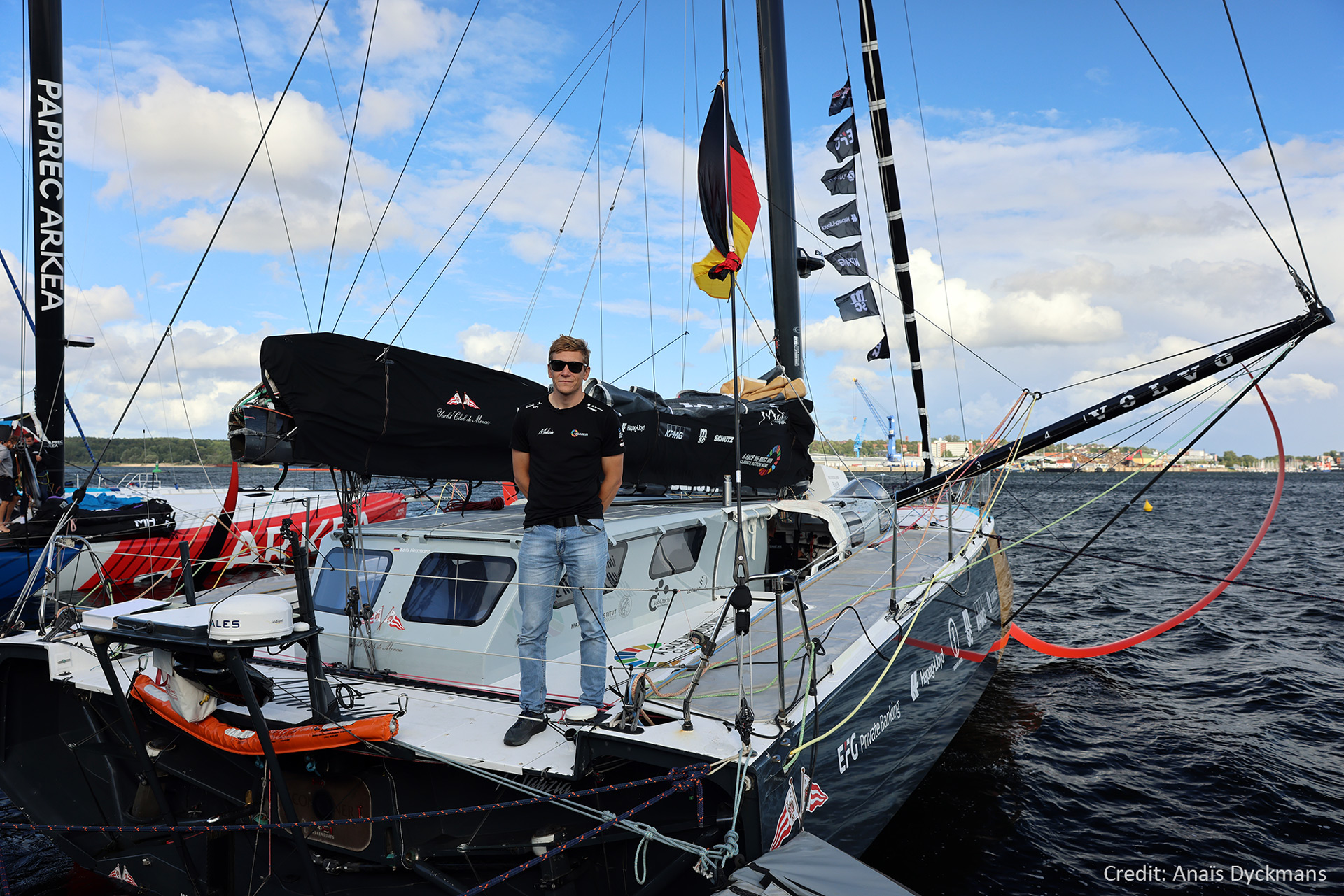 Team member Will Harris on the deck of the racing yacht Malizia.