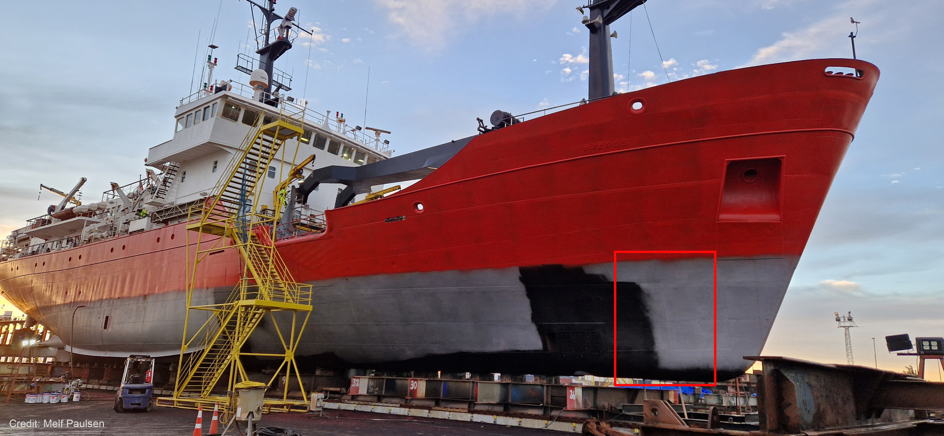 A photo of a ship - MV Pharos - at the dock.