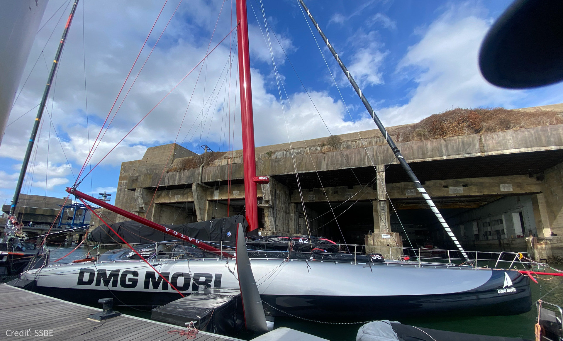 The racing yacht DMG MORI Global One in laying in the harbour.